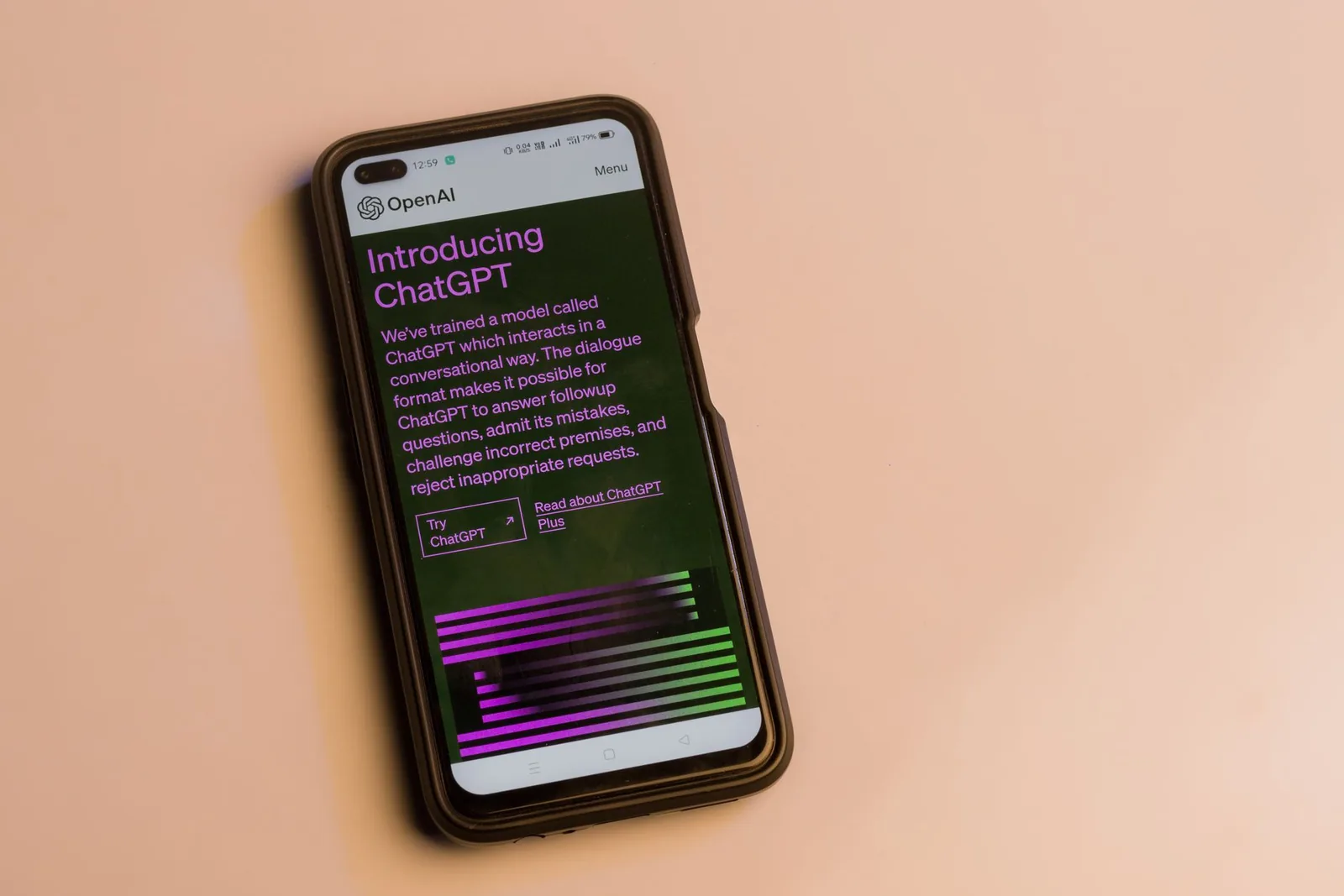 A phone on an orange background showing the introduction screen of ChatGPT.